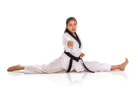 One punch tae kwon do  girl doing split, full length portrait isolated Stock Photos