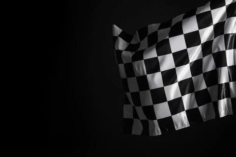 One racing checkered flag on black background, space for text 스톡 사진