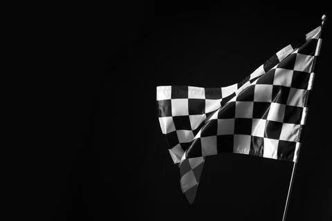 One racing checkered flag on black background, space for text 스톡 사진
