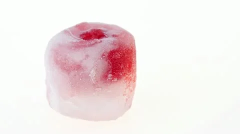 One raspberry berry inside of melting ice cube, time lapse video Stock Footage 10914229