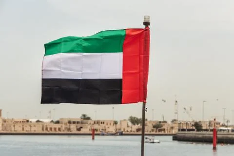 One rectangular colored flag on the sea bank background 스톡 사진