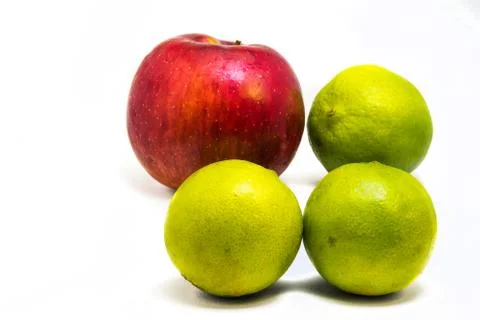 One red apple and three green lime Foto stock