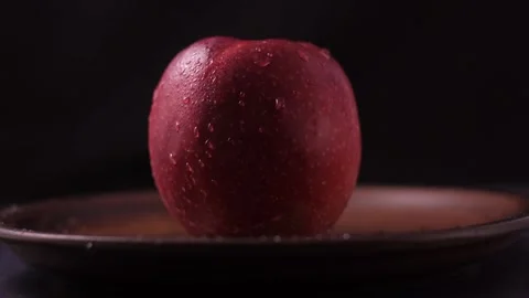 One red apple on the table. Stock Footage 186988700