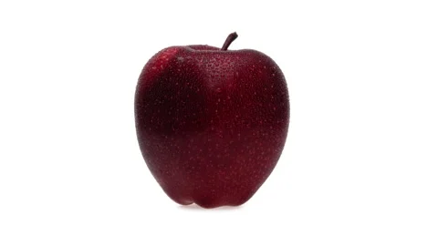 One red apple with water drops is rotating on white background. Isolated. Stock Footage 169751070