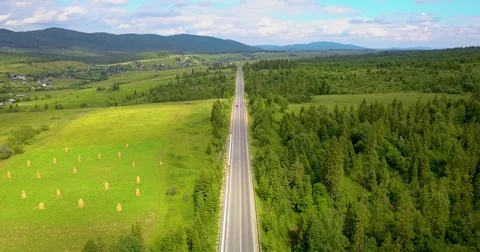 One red car goes on the road in the mountains Stock Footage 84911204
