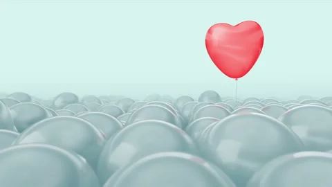 One red heart balloon is flying through other white balloons. Bright light Stock Footage 121926375