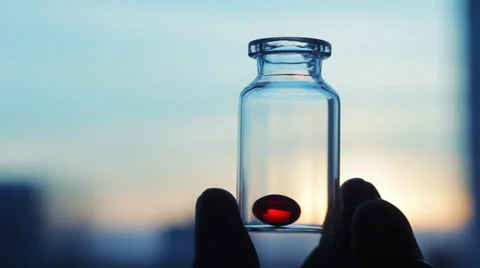 One Red Pill Vitamin E Capsule in Bottle against Sunset Sky, #2 Pharmacy HD Stock Footage 34524063