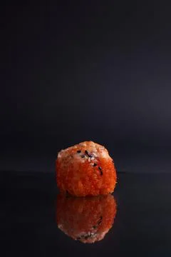 One roll in focus, a portion of rolls out of focus, Asian food, sushi and fish Stock Photos