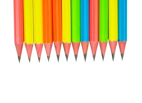 One row of different colored normal wood pencil on a white paper background Stock Photos