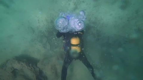 One Scuba Diver Makes Bubble When Breathes Underwater Stock Footage 143592354