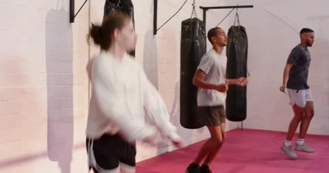 At one second, diverse group spinning jump ropes and skipping in boxing training Stock Footage 337623882