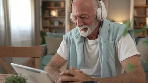 One senior man use digital tablet to watch movie or have a video call 스톡 동영상 250347251