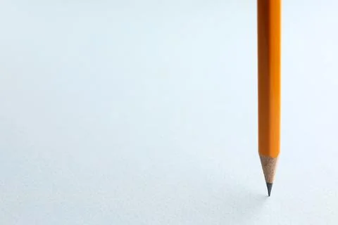 One sharp graphite pencil on white background, closeup. Space for text Stock Photos