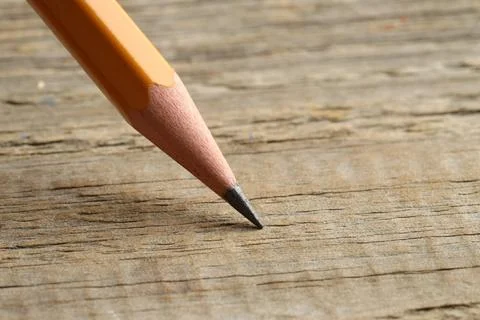 One sharp graphite pencil on wooden table, closeup. Space for text 스톡 사진