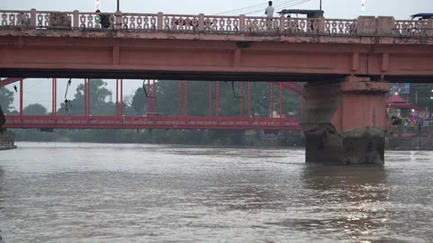 One side of the bridge is visible behind the old constructed bridge and the Stock Footage 217399442