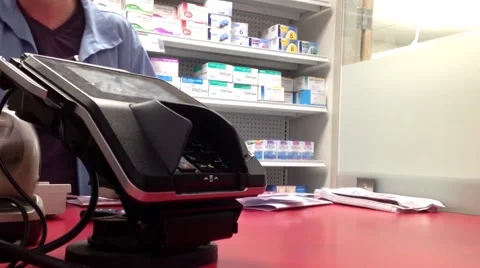 One side of check out counter at pharmacy store Stock Footage 57416260