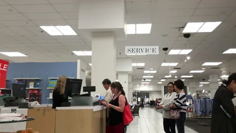 One side of customer line up for paying stuff at service counter inside Video stock 161223587