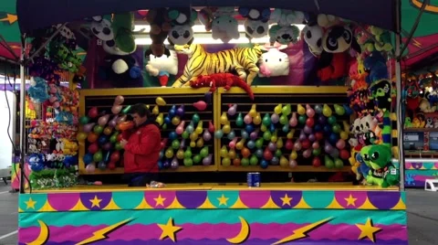 One side of dart throw at balloons in carnival game Stock Footage 49065290