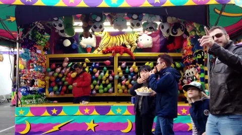 One side of dart throw at balloons in carnival game Stock Footage 49065319