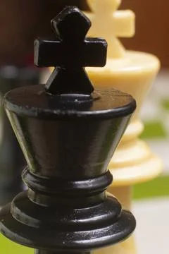 One side light on Black king chess piece. close up photo 스톡 사진
