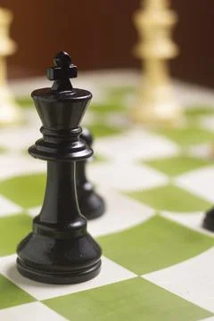 One side light on Black king chess piece. close up photo Foto stock