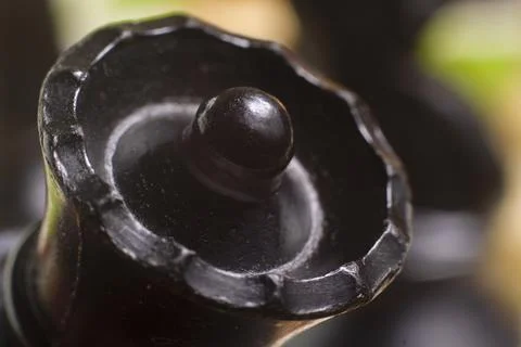 One side light on Black queen chess piece. close up photo Foto stock