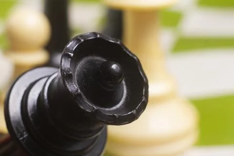One side light on Black queen chess piece. close up photo 스톡 사진