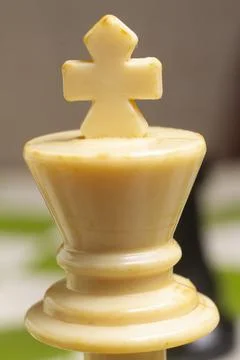 One side light on white king chess piece .close photo Stock-Fotos