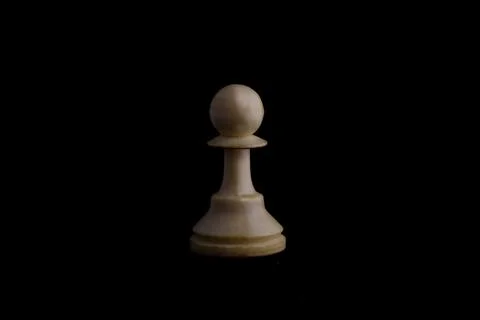 One side light on white pawn chess piece in black background Foto stock