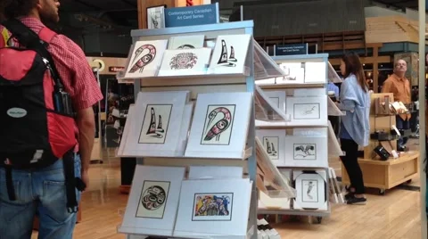 One side of passengers inside gift shop at yvr airport Stock Footage 42620233