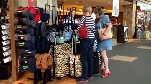 One side of passengers inside gift shop for buying luggage Stock Footage 46488441