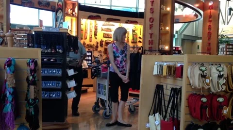 One side of passengers inside gift shop at YVR airport Stock Footage 57415039