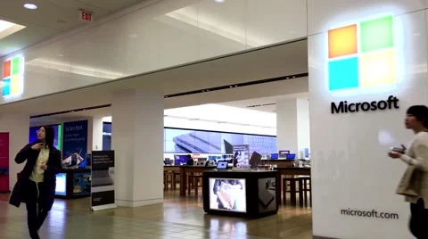 One side of people browsing at Microsoft store inside Burnaby shopping mall Video stock 63252776