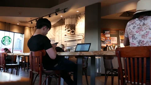 One side of people drinking coffee inside Starbucks store with 4k resolution. Stock Footage 127890866
