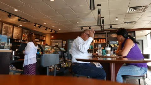 One side of people drinking coffee and discussing business Video stock 250456043