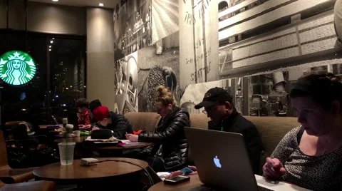 One side of people enjoying coffee at Starbucks Stock-Footage 59209165