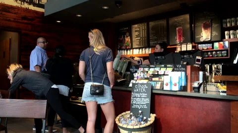 One side of people line up for ordering coffee and chatting Stock Footage