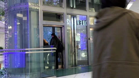 One side of people taking elevator in Burnaby shopping mall Stock Footage 58936813