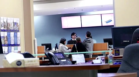 One side of receptionist dealing of customer data inside Royal bank. Stock Footage 59952323