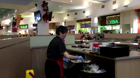 One side of worker cleaning garbage at food court area inside shopping mall Stock Footage 58850555