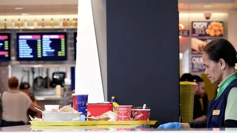 One side of worker cleaning leftover food at food court sorting station Stock Footage 75466993