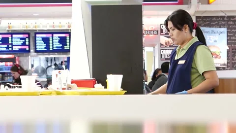 One side of a worker cleaning leftover food 스톡 동영상 201059607