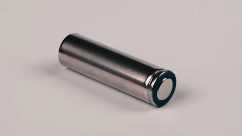 One silver AA batteries isolated on white. Side view. Loop motion. Stock Footage 237693867