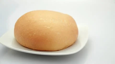 One simple bread rotating Video stock 10820011