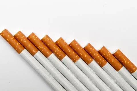One single cigarette close up isolated on a white background Stock Photos