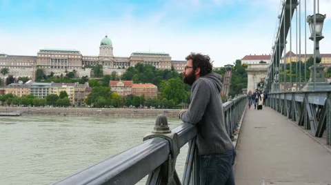 One single man looking budapest castle view, chain bridge, 4k Stock Footage 58747169