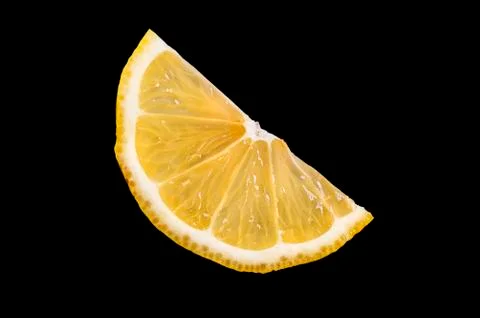 One slice of half a lemon on a black background Stock Photos