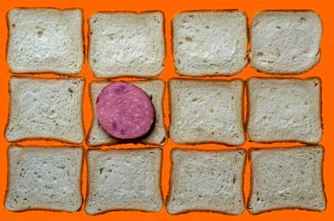 One slice of salami and bread for sandwiches. Stock Photos