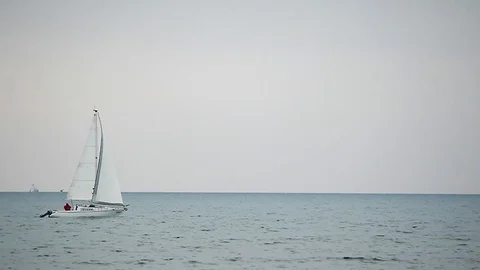 One sloop on the Adriatic Sea in winter Stock Footage 125796248