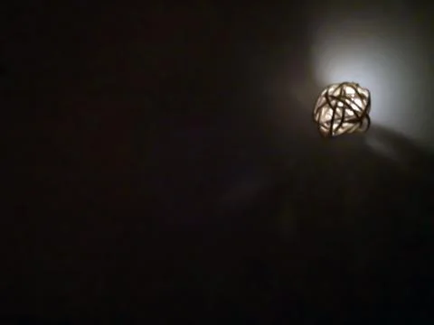 One small decorative luminous ball, close up, night time Stock Photos
